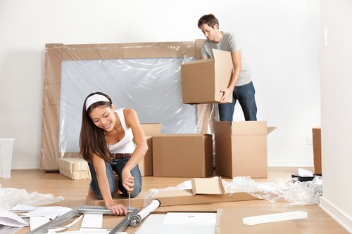 Man and van service loading household items into a moving vehicle