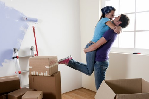 Boxes and furniture representing a small-load moving quote