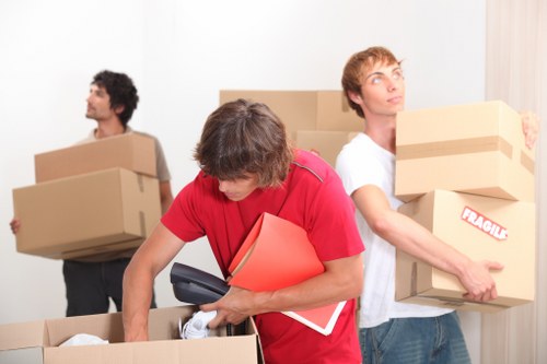 A moving team preparing boxes in a Beckenham property
