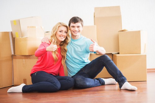 Careful loading of bulky household furniture by a local removals team